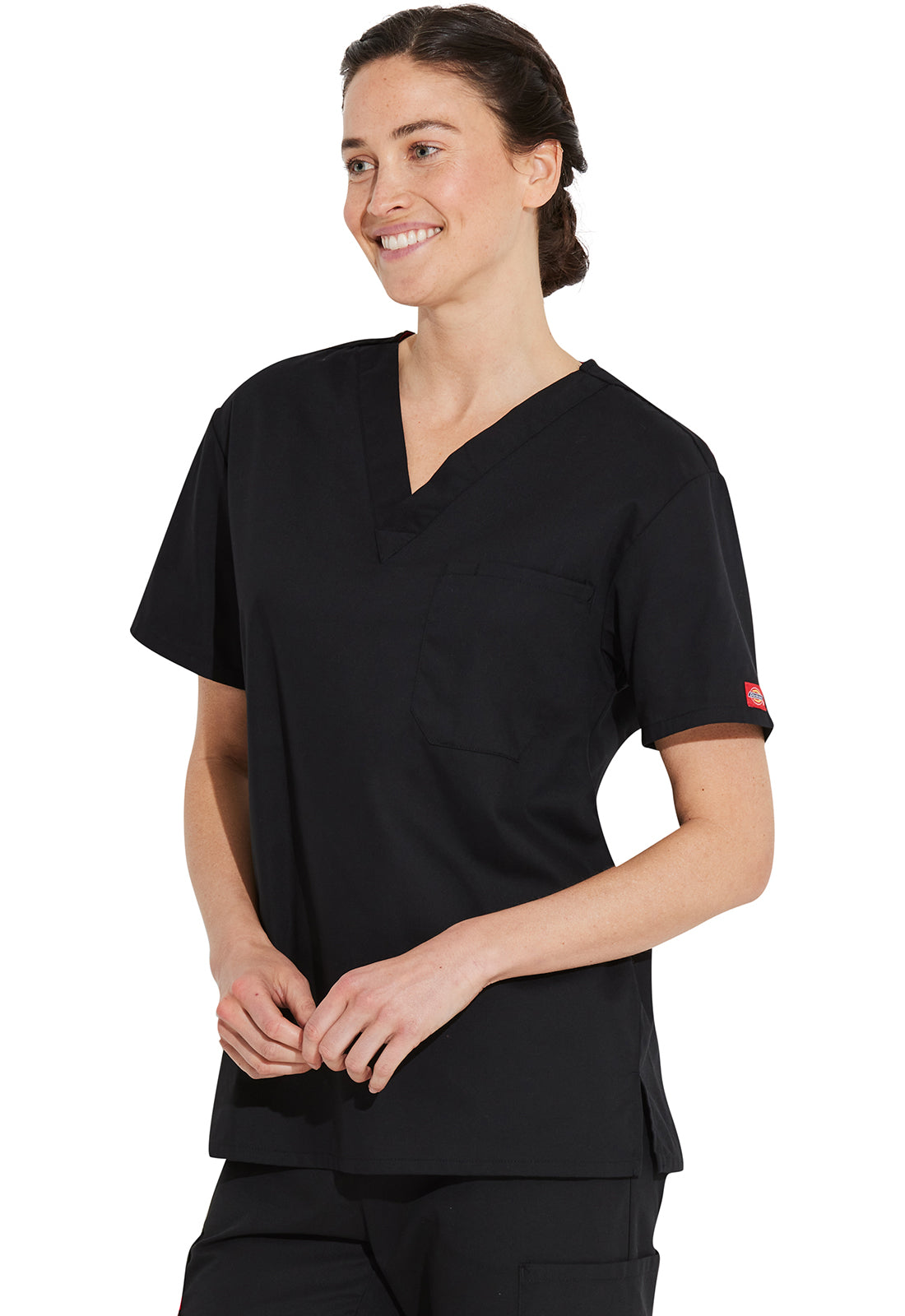 Unisex top met V-hals die in de broek gedragen kan worden met borstzak en zijsplitten