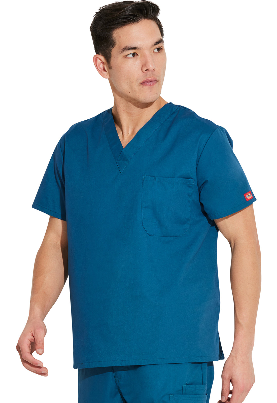 Unisex top met V-hals die in de broek gedragen kan worden met borstzak en zijsplitten