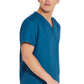 Unisex top met V-hals die in de broek gedragen kan worden met borstzak en zijsplitten