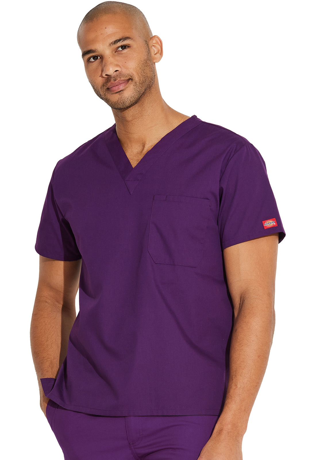 Unisex top met V-hals die in de broek gedragen kan worden met borstzak en zijsplitten