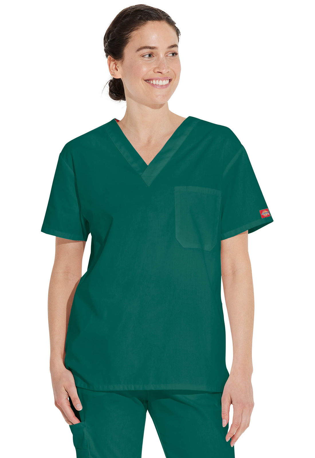 Unisex top met V-hals die in de broek gedragen kan worden met borstzak en zijsplitten