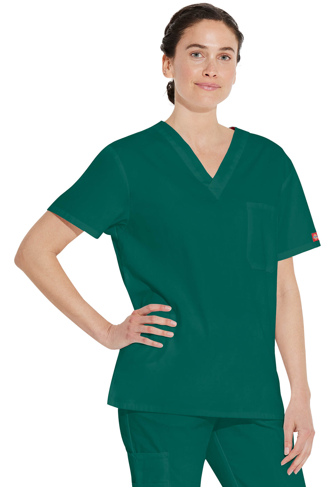 Unisex top met V-hals die in de broek gedragen kan worden met borstzak en zijsplitten