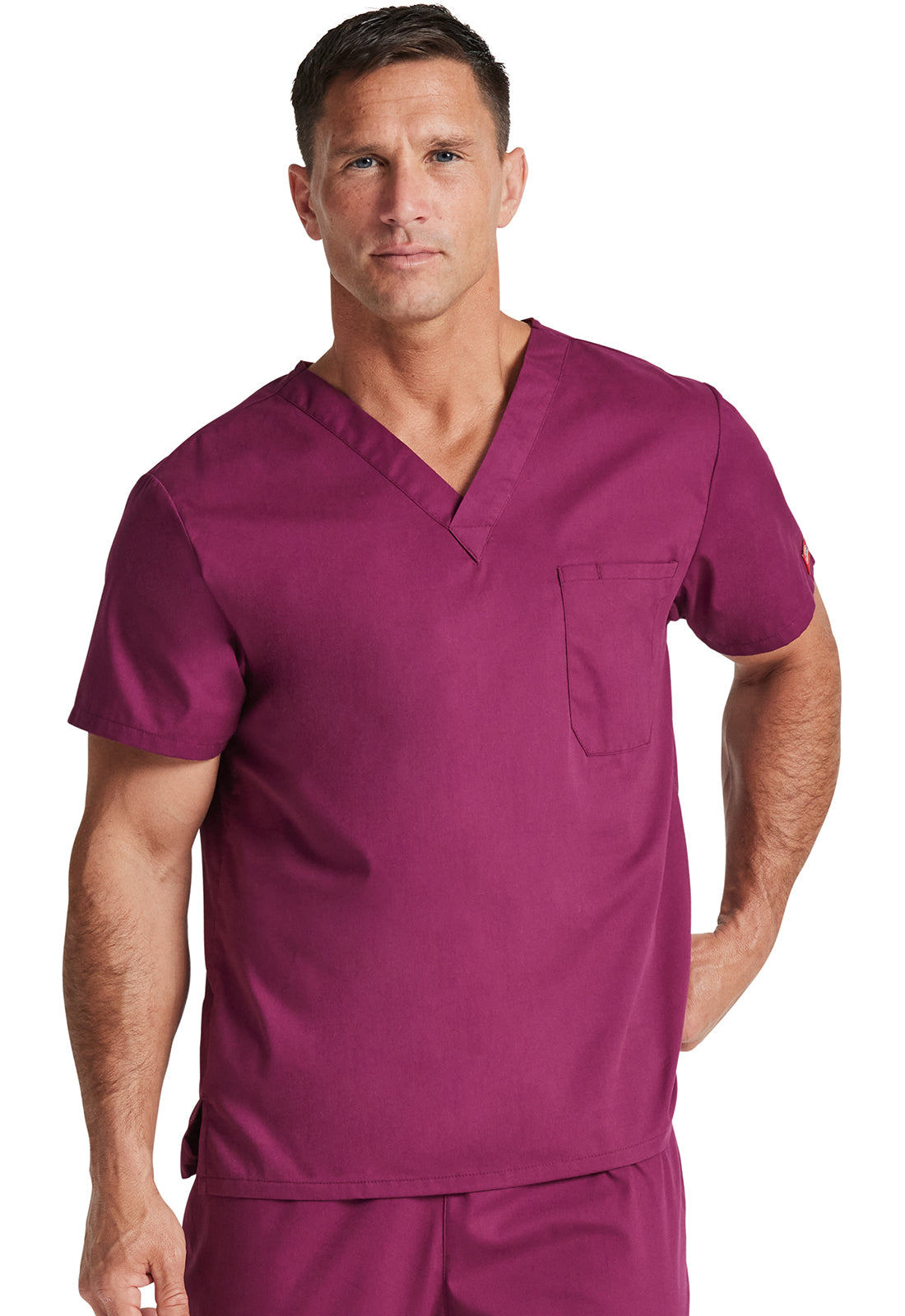 Unisex top met V-hals die in de broek gedragen kan worden met borstzak en zijsplitten