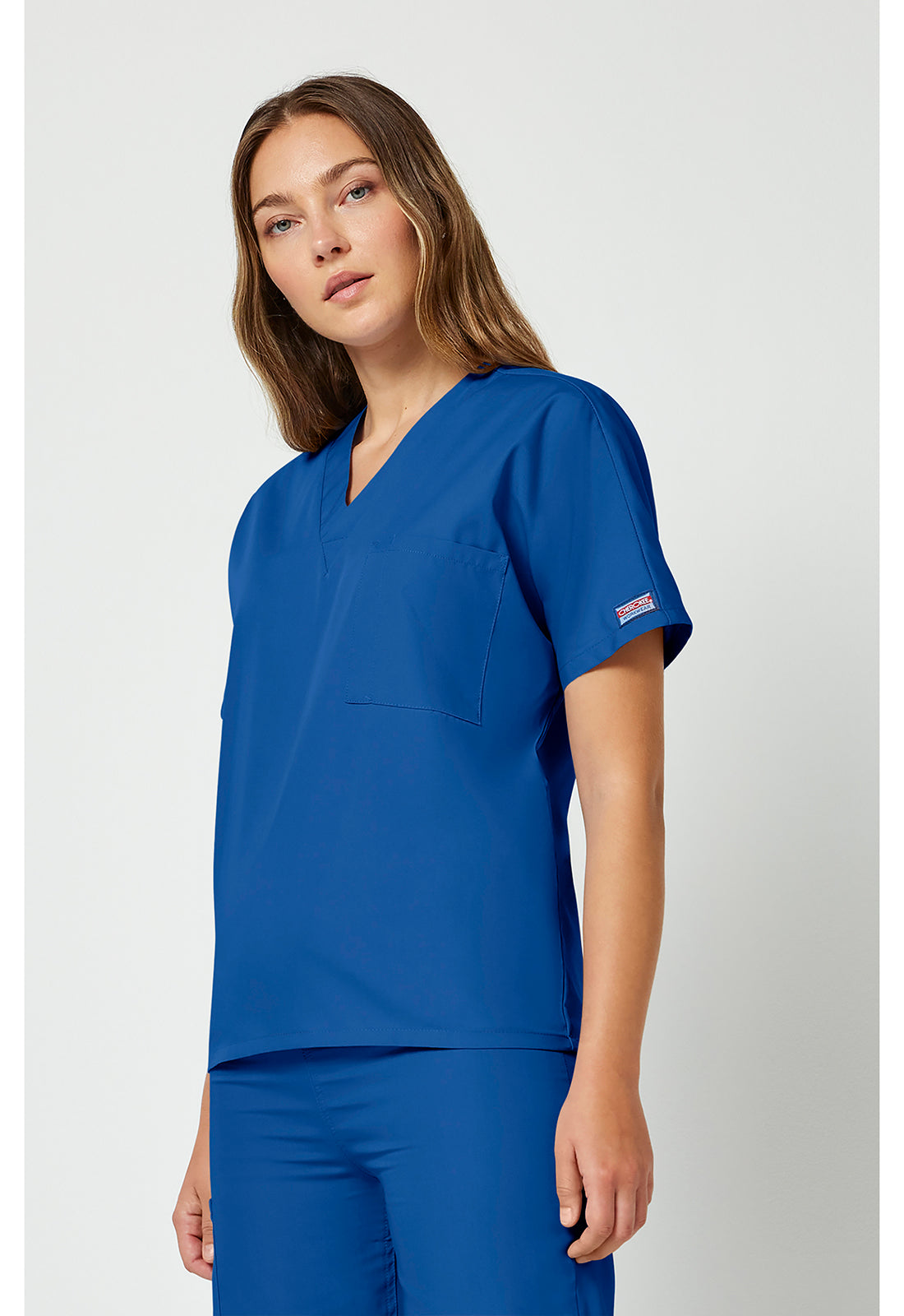 Cherokee Workwear Unisex tuniek met V-hals met vleermuismouwen en borstzak WWE4777